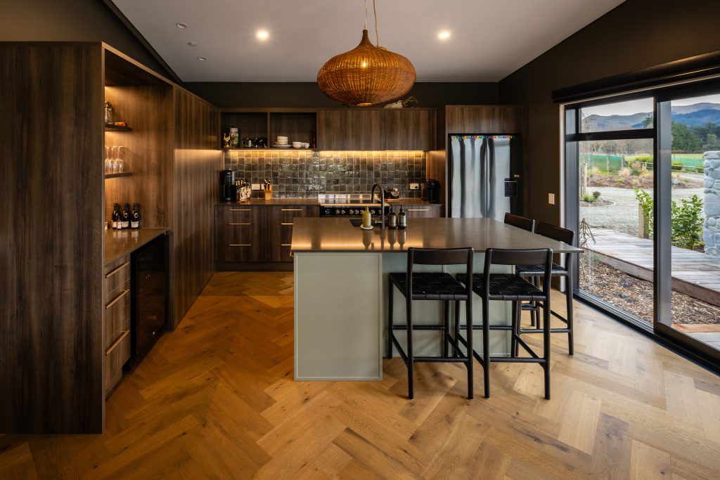 Chefs kitchen with island bench and breakfast bar