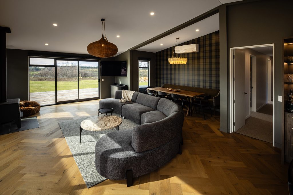 Living opens onto the deck on two sides